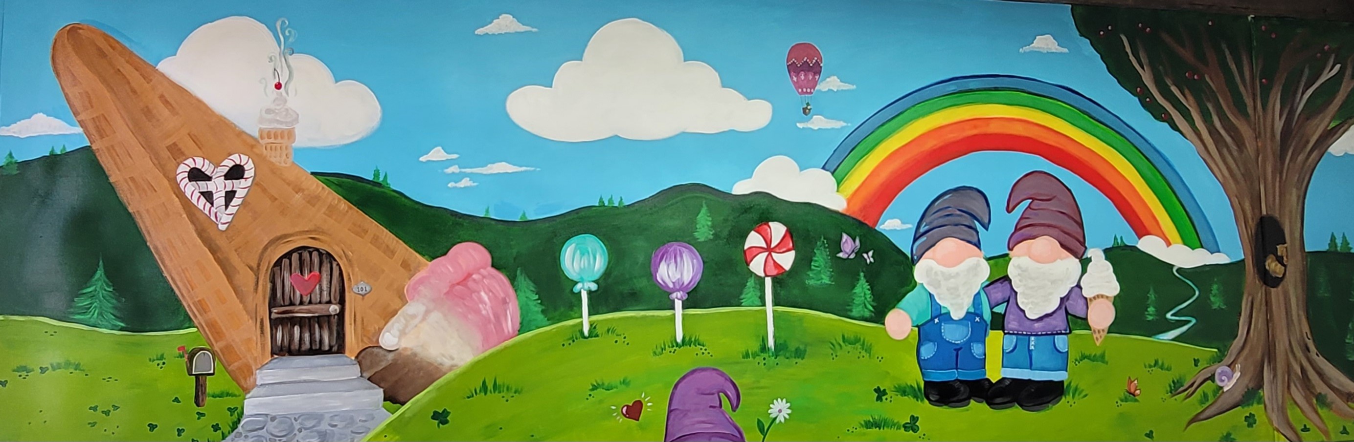 The Corner Cup’s colorful hand-painted gnome and rainbow mural