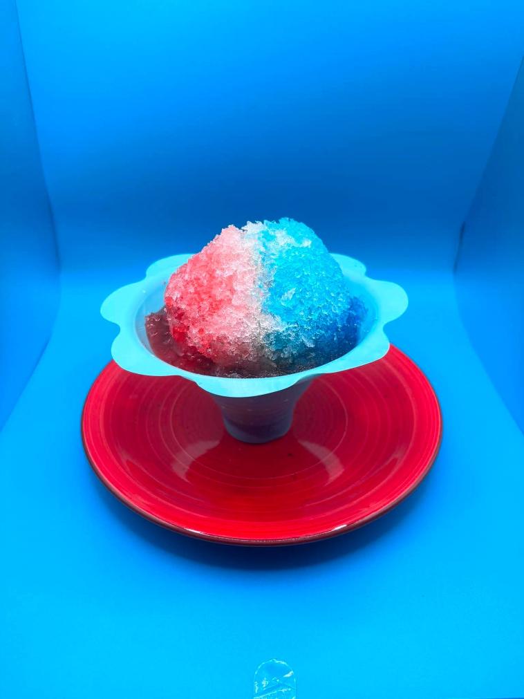 Red, white and blue shaved ice in a flower cup